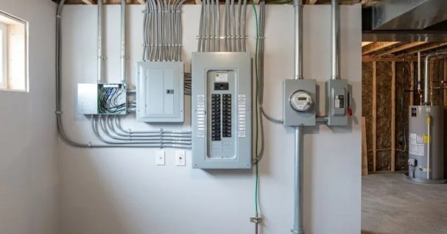 Homeowner documenting an electrical panel for an inspection request
