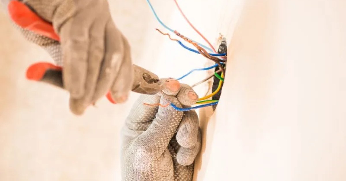 Residential electrical repair at a wall outlet